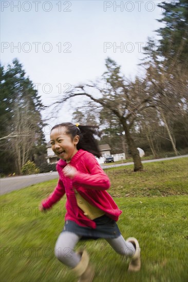 Korean girl running outdoors