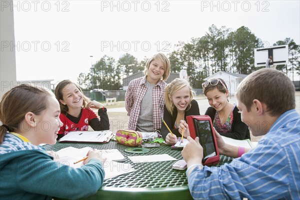 Caucasian friends doing homework together