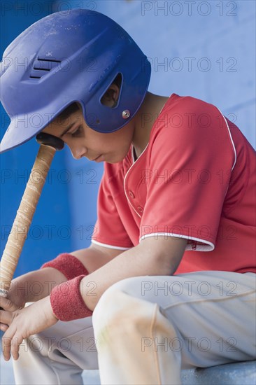 Sad Hispanic baseball player