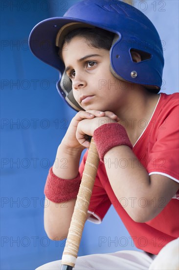 Sad Hispanic baseball player