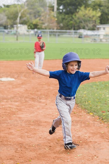 Hispanic boys playing baseball