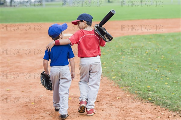 Hispanic boys on baseball field