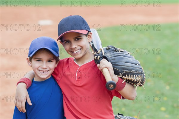 Hispanic boys in baseball uniforms