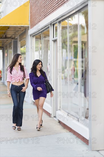 Hispanic friends shopping together