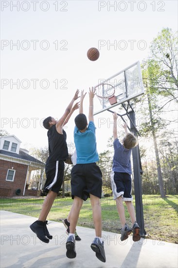 Boys playing basketball