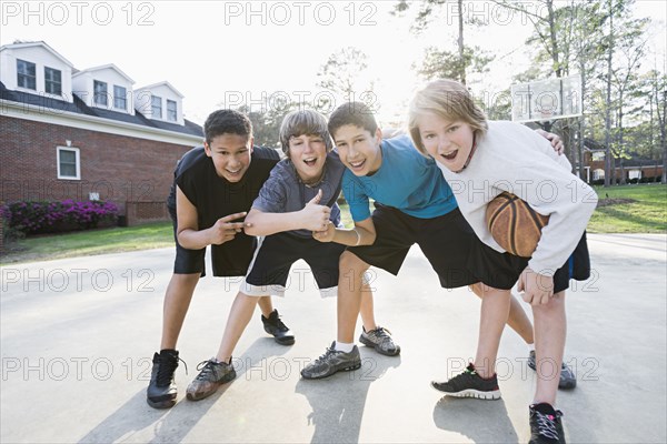 Boys playing basketball