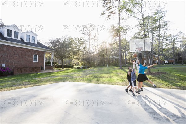 Boys playing basketball