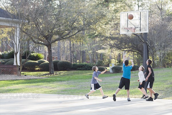 Boys playing basketball