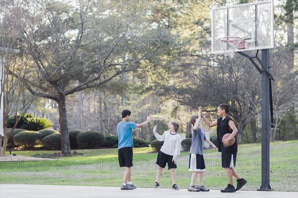 Boys playing basketball