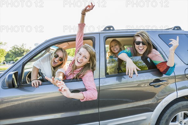 Playful friends in car