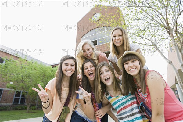 Smiling Caucasian friends standing together