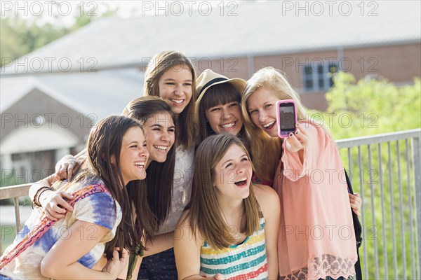 Caucasian friends taking self-portrait