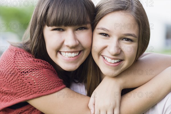 Caucasian friends hugging