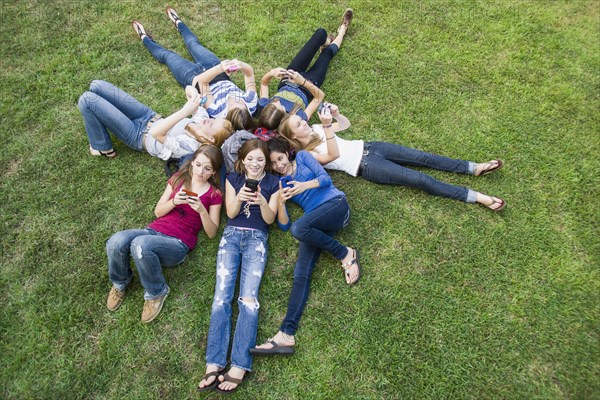 Friends hanging out together on grass