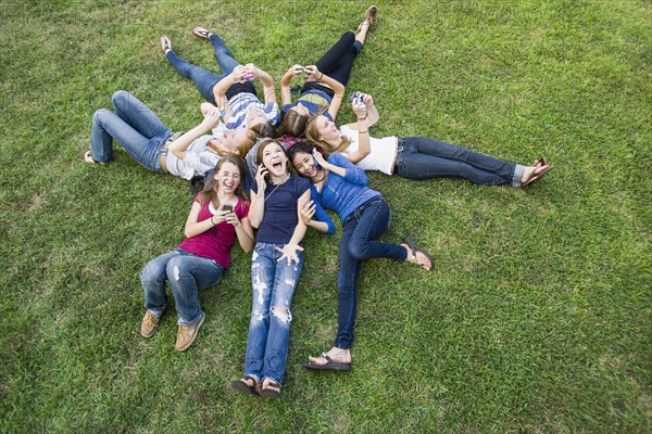 Friends hanging out together on grass