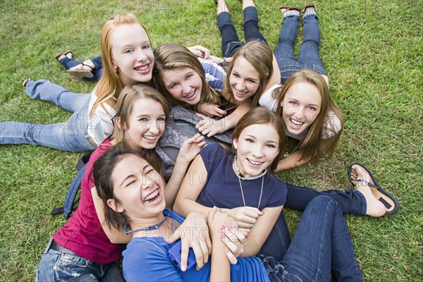 Friends hanging out together on grass