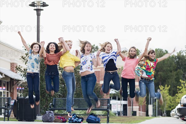 Friends hanging out together and jumping