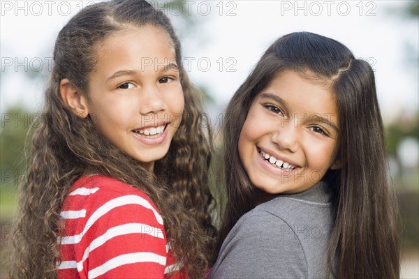 Smiling girls walking outdoors