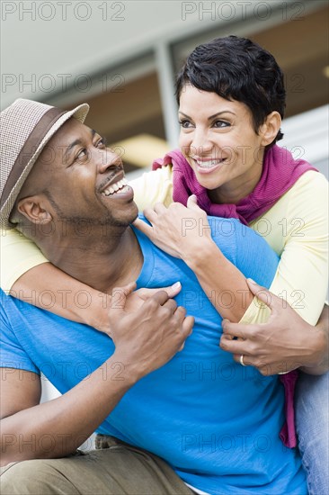 Smiling couple hugging outdoors