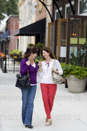 Caucasian women talking on city street