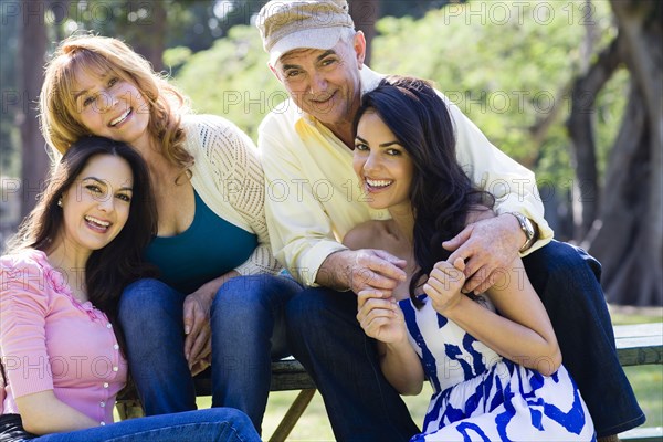 Hispanic family smiling outdoors