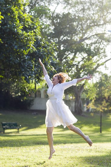 Hispanic woman dancing outdoors