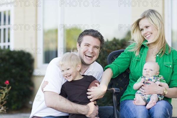 Caucasian family relaxing outdoors