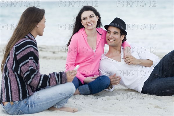 Friends relaxing together on beach