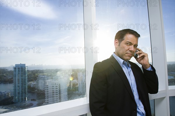 Hispanic businessman talking on cell phone