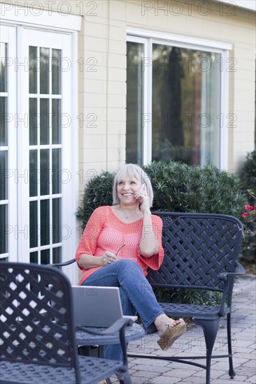 Caucasian woman talking on cell phone