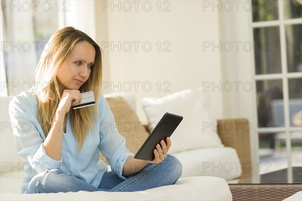 Caucasian woman shopping online with digital tablet