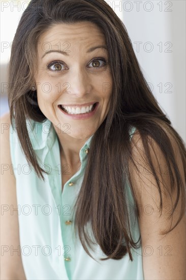 Surprised Caucasian woman shrugging