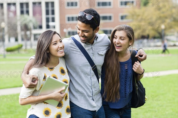 Smiling students walking on campus