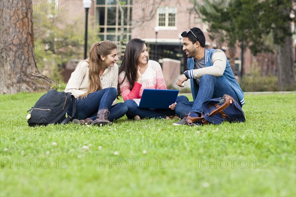 Students using laptop on campus