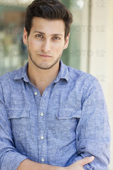 Hispanic man standing outdoors