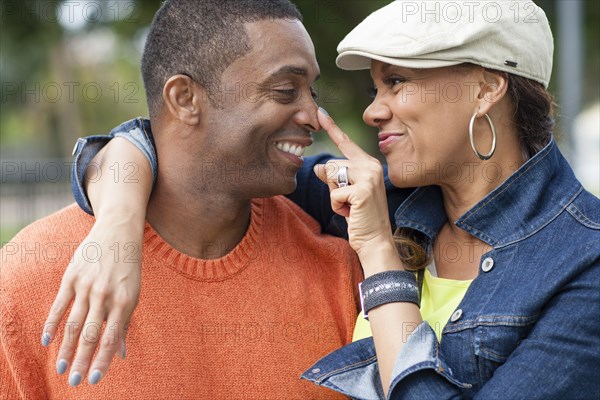 Close up of couple playing outdoors