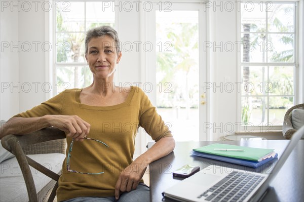 Woman using laptop in living room