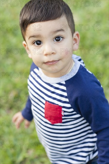 Close up of Hispanic boy outdoors