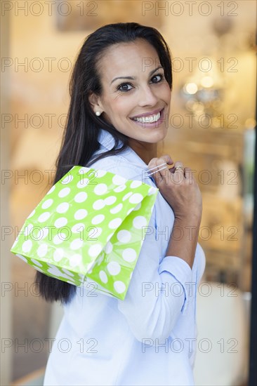 Hispanic woman shopping outdoors