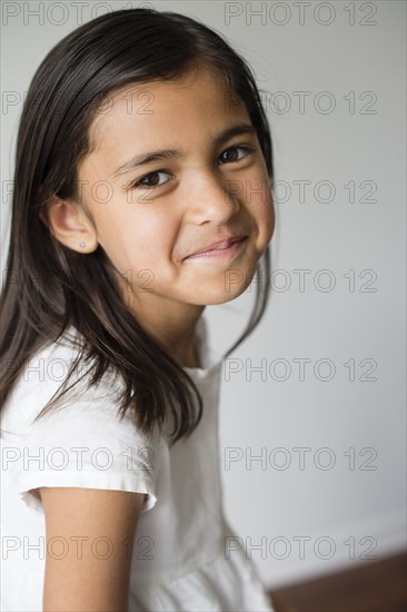 Close up of smiling girl indoors