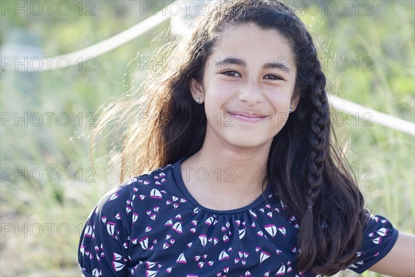 Mixed race girl smiling outdoors