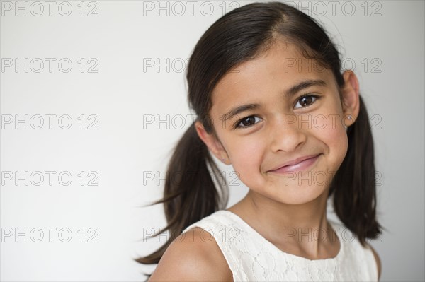 Close up of smiling girl wearing pigtails