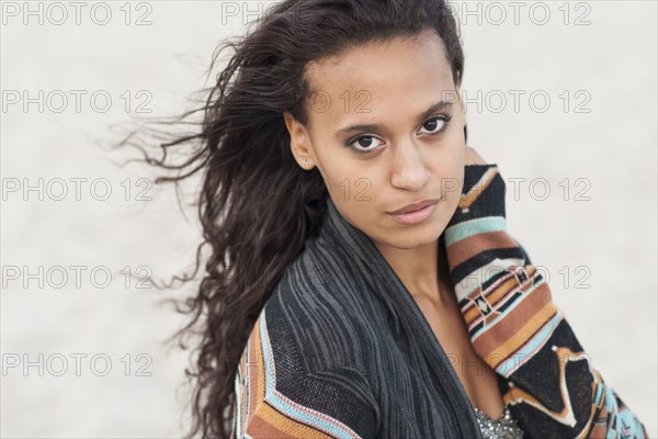 Mixed race woman wearing stylish sweater