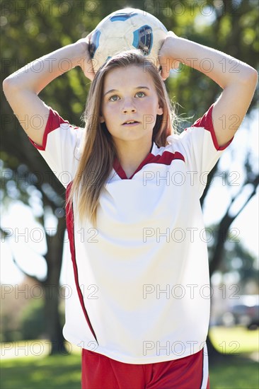 Caucasian soccer player throwing ball