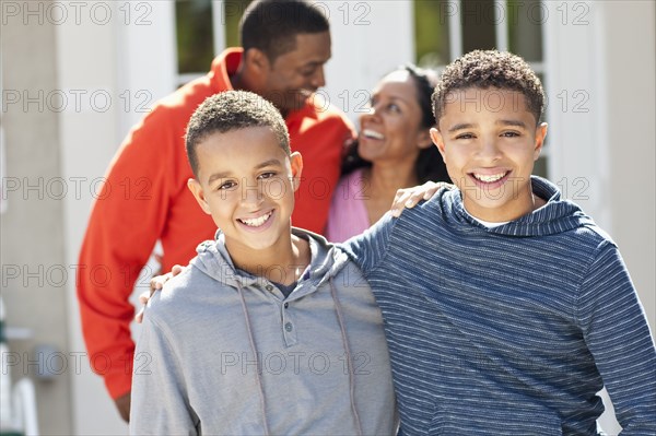 Close up of brothers hugging outdoors