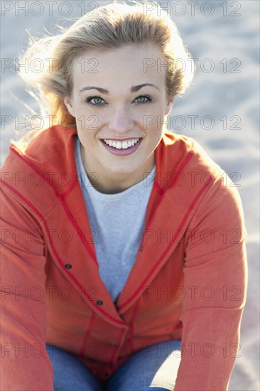 Caucasian woman smiling on beach