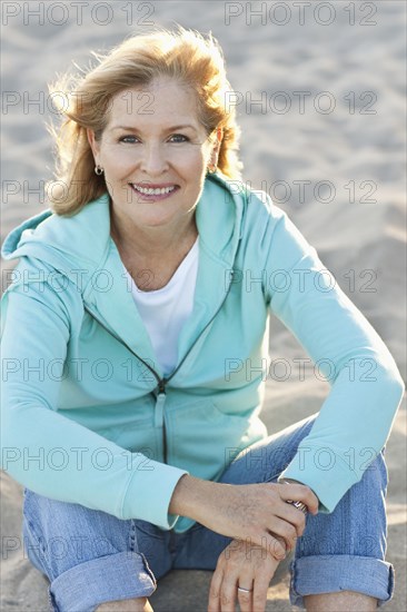 Caucasian woman smiling on beach