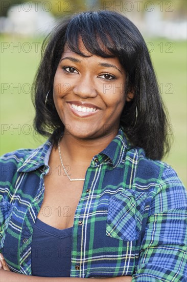 African American teenage girl smiling outdoors