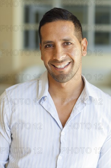 Close up of Hispanic man smiling