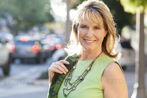 Caucasian woman smiling in city